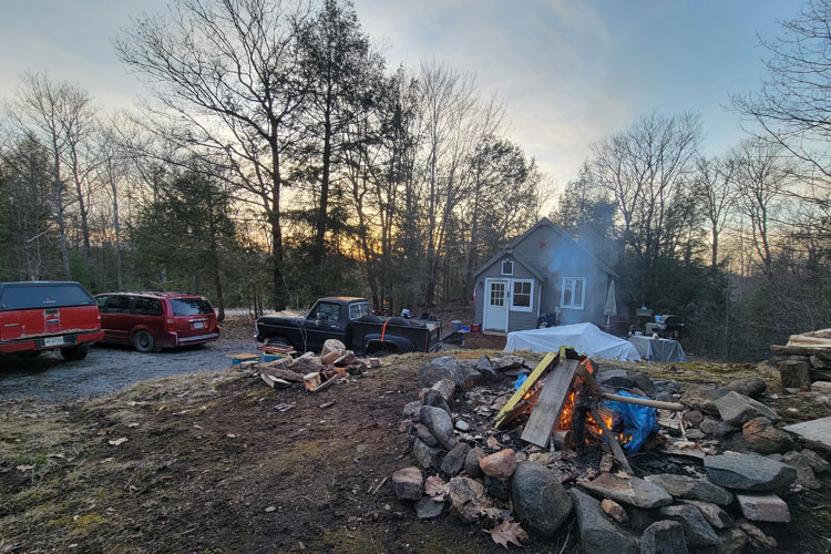 hunt cabin with fire in foreground